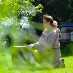 Trish O Neill - a third generation beekeeper - at work with her bees in Dunhill, Co. Waterford